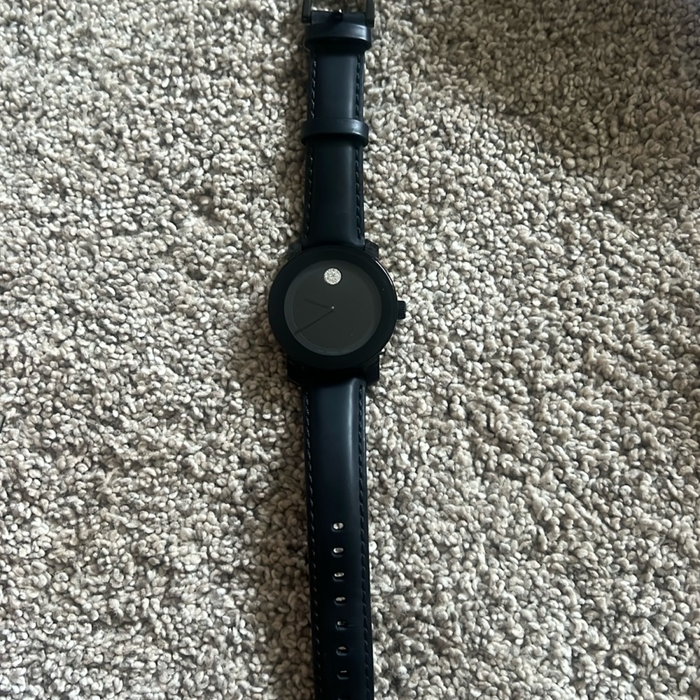 Black Movado watch in great condition. Battery needs to be changed